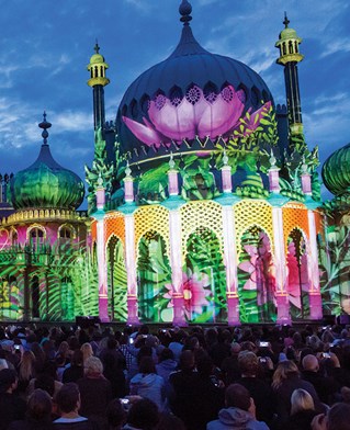 The outside of the Brighton Pavilion decorated with floral light projection