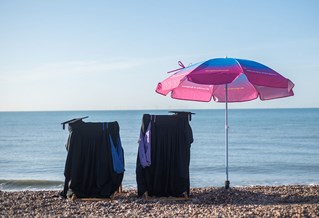 Graduation gowns on sunny Brighton beach