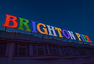 Close up of colourfully lit up Brighton sign on the pier
