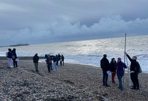 Students carrying out fieldwork at the beach