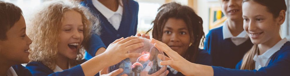 school children touching a plasma globe