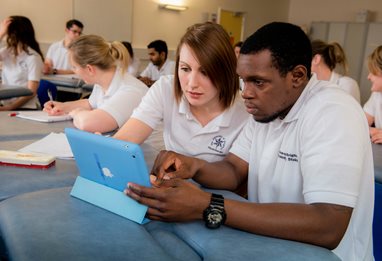 Two physiotherapy students using tablets