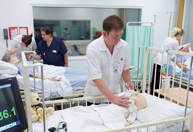 Nursing students training with dummies