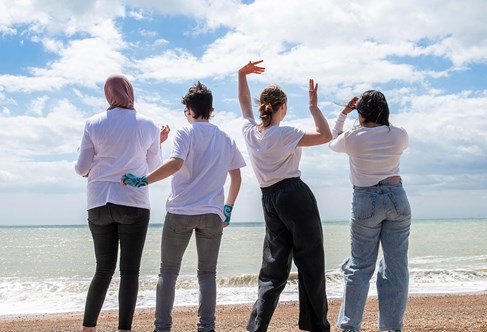 Group of students on Brighton beach