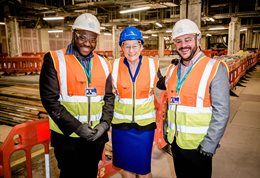 David Oyegbile, Professor Humphris and Quico Candea Lopez in a warehouse wearing hi-vis clothing