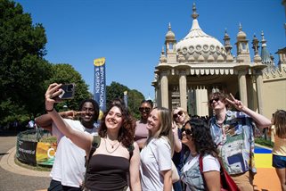 Students posing for photos outside the Brighton Royal Pavilion
