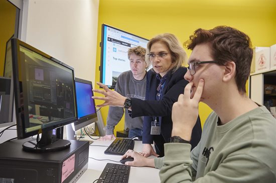 computing students with lecturer