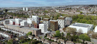 Drone photo of Moulsecoomb campus with the 'Big Build' development of contemporary high-rise blocks and Mithras House in foreground