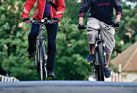 Cyclists pedalling on the road