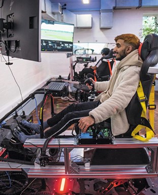 Student using a driving simulator