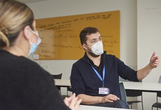 Tutor and student in face masks