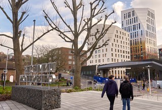 Students walking between university buildings in Moulsecoomb