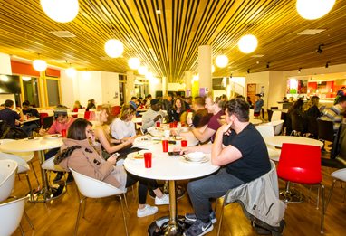 Students eating at the Hub