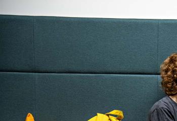 Two students sitting on a sofa and talking