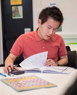 Business student studying at desk