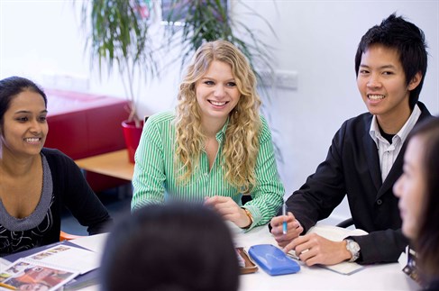 Students sitting around a desk