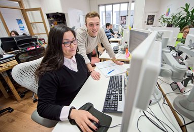 Business school students on placement in office