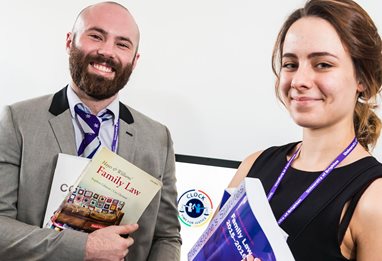 Law students holding law books