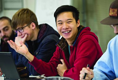 Male students on their laptops