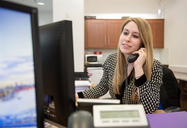 A woman on a telephone