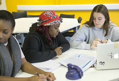 Three female business students working together
