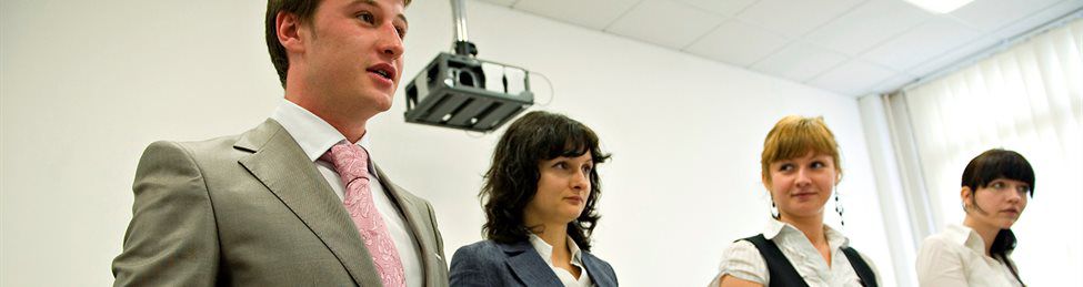Four business school students giving a presentation