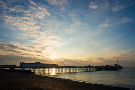 Silhouette of Brighton pier at sunrise