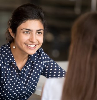 An apprentice talking an employer