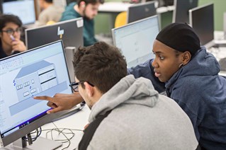 Quantity Surveying students at a computer