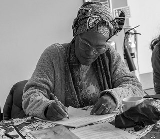 Women writing at Lewes story event