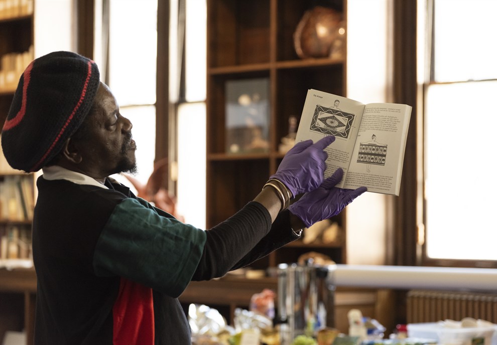 Tony holding up book