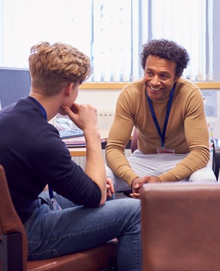 Student with researcher in university tutorial rooms