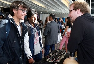 Students speaking with an employer at a careers event