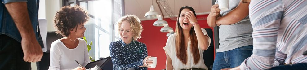 Two people meeting with careers advisor over coffee