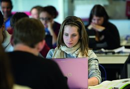 Student with pink laptop