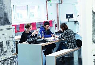 Students working around a desk