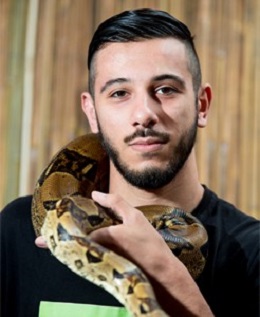 Faik Aktulga holding a large snake