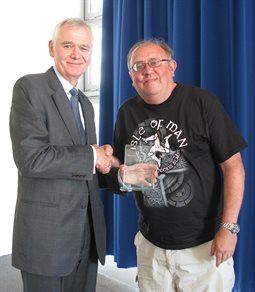 Momentum Hastings Mentor of the Year 2016-17 Graham Bean, receiving his award from Hastings Campus Director, Paul Frost
