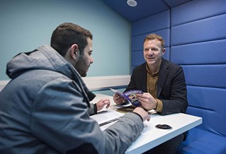 beepurple adviser with student in booth