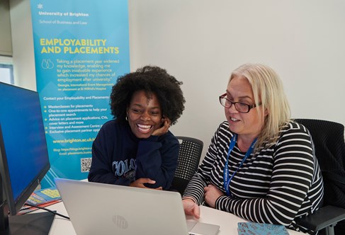A careers advisor chatting to a student