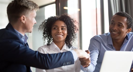 shaking hands over a business deal