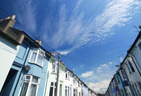 A street showing Brighton's traditional white or brightly coloured terraced houses