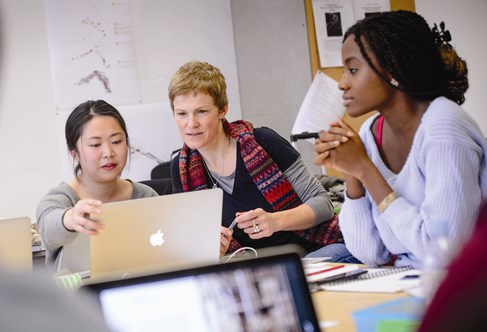 Adult helping young people apply