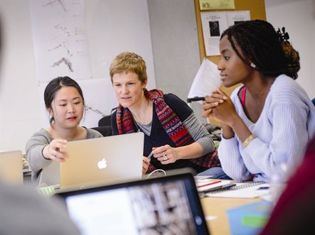 Adult helping young people apply