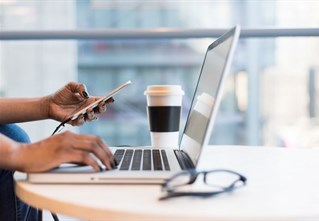 student using a laptop to apply for clearing