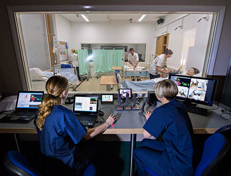 Nursing students in university nursing suite