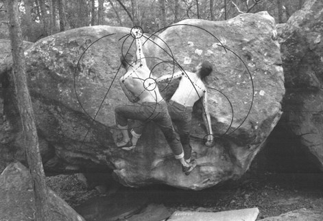 two men tops off climbing a rock