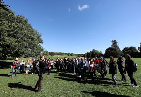 Creative writing students in the field