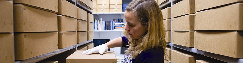 Student archiving materials in warehouse