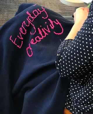 Embroidered cloth making the phrase Everyday Creativity.